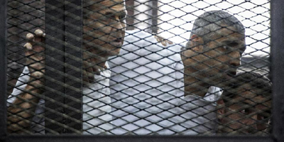 Egypt court orders retrial of jailed Jazeera reporters